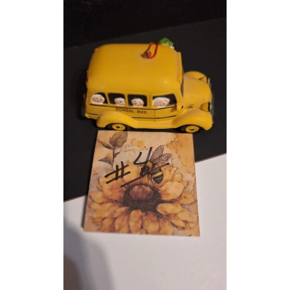 Resin school bus Christmas ornament with Santa and children